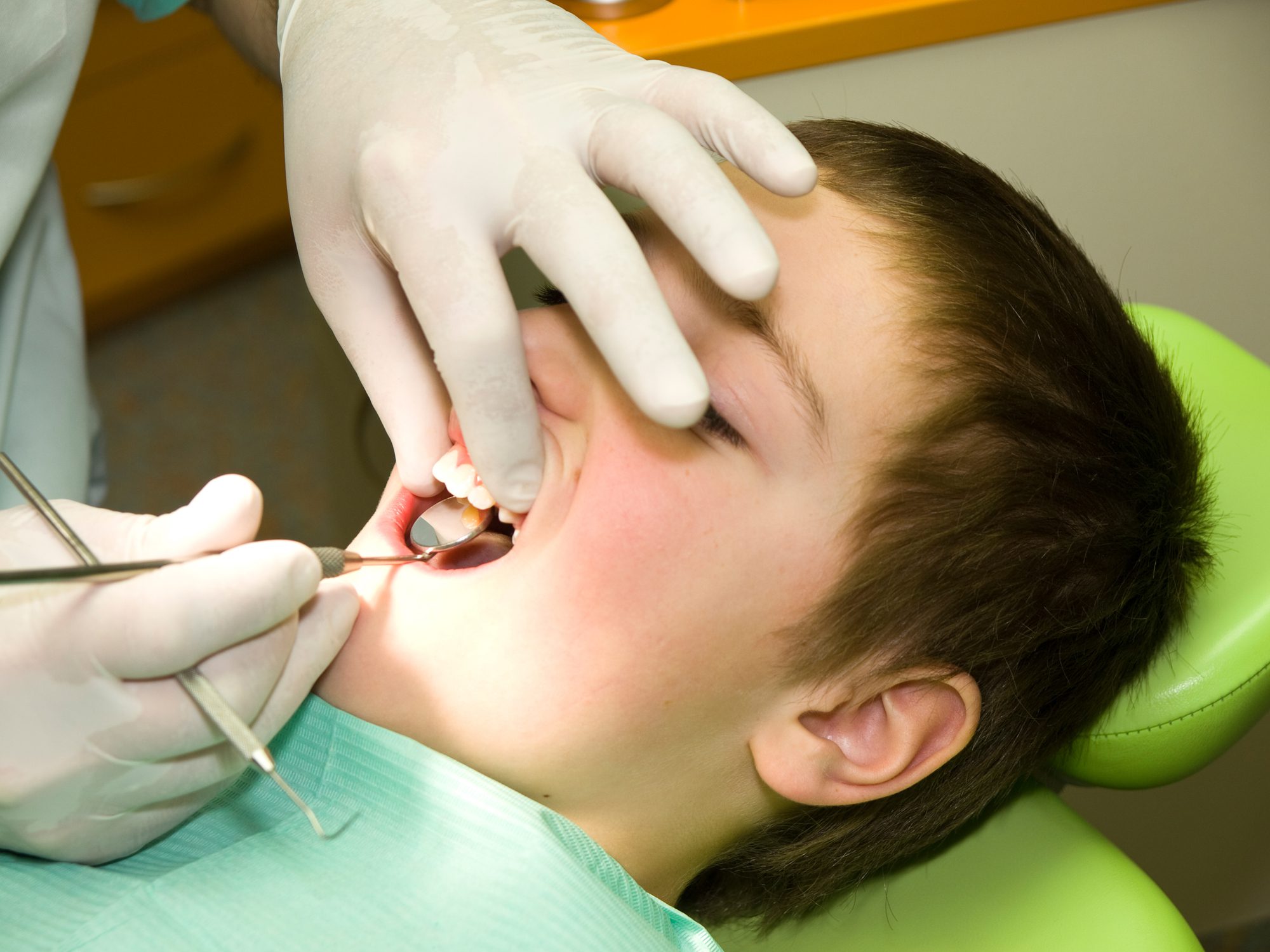 Dental care Young boy under dental preventional examination